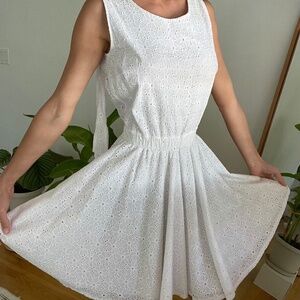 Small white summer dress with open back